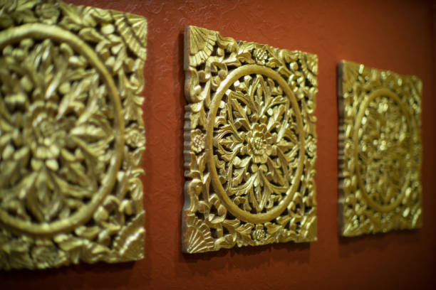 istock Wall decoration. A carved pattern of wood in gold. 873161836