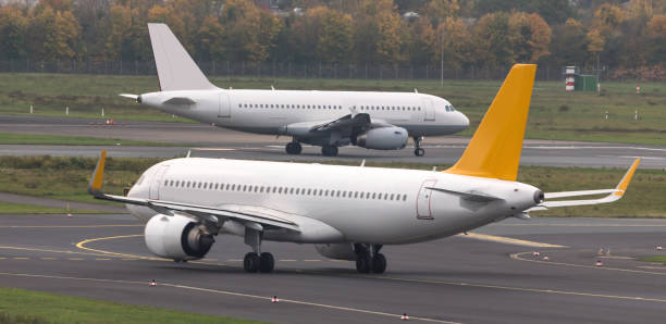 istock two airplanes speeding at an airport runway 873169188