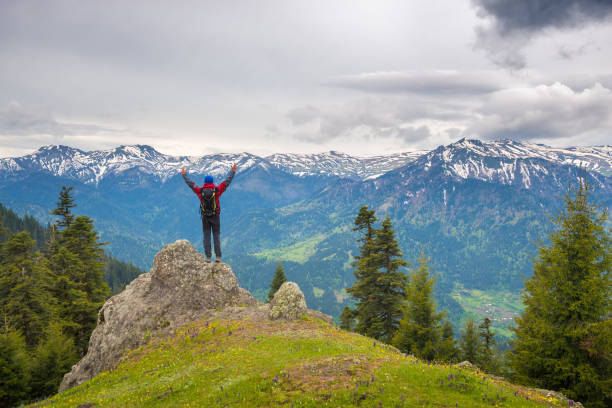 istock Happy adventurer with open arms 873172614