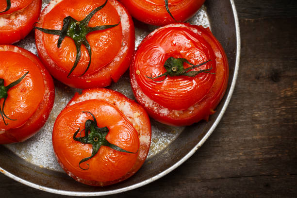 istock Baked tomatoes stuffed with vegetables and parmesan 873180580