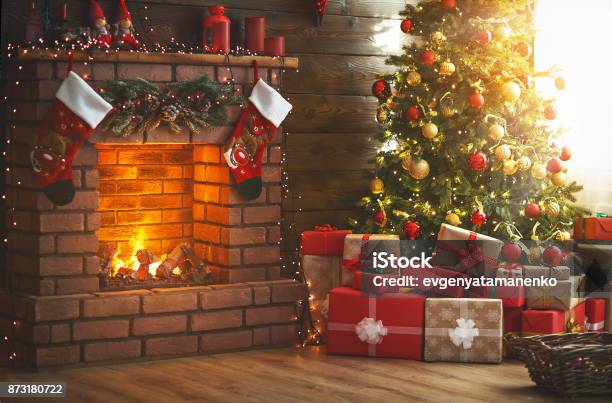 Interior Christmas Magic Glowing Tree Fireplace Gifts Stock Photo - Download Image Now