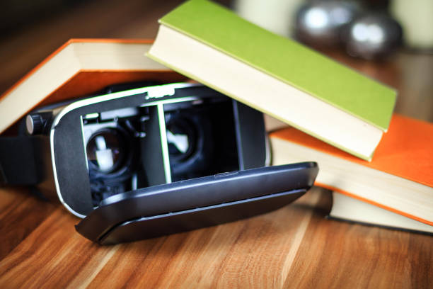 istock VR glasses and books on a table symbolizing digital learning 873184516