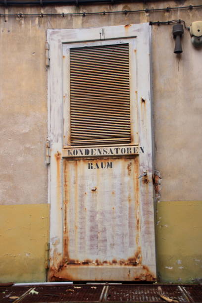 istock Old door with the inscription Capacitors Room 873184668