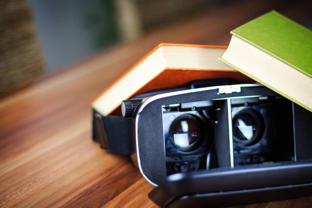 istock VR glasses and books on a table symbolizing digital learning 873184690