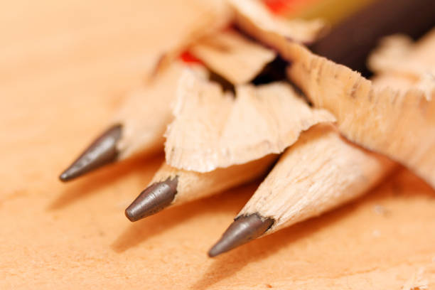 sharpened pencils on a wooden background closeup.