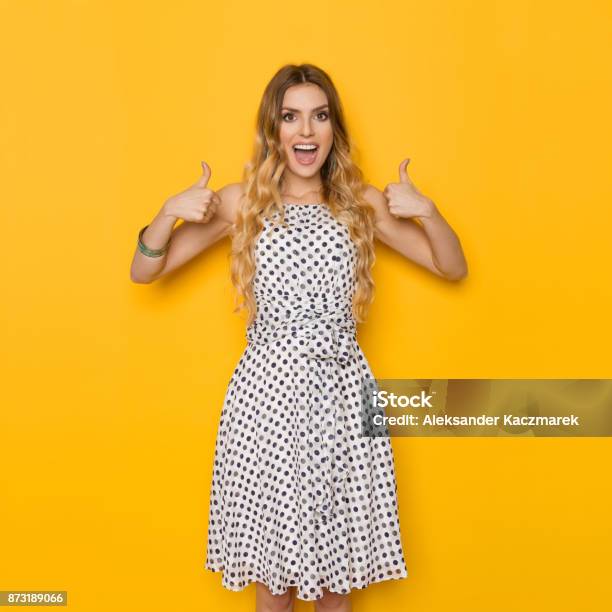 Excited Woman Is Shouting And Showing Thumbs Up Stock Photo - Download Image Now - Thumbs Up, Women, One Woman Only