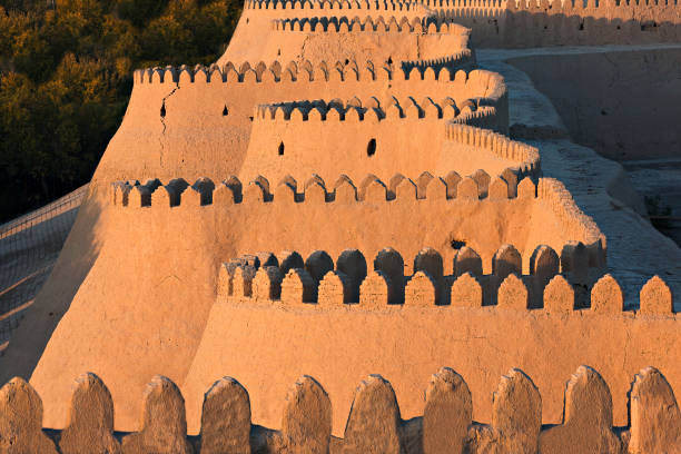 City walls of Khiva, Uzbekistan. Ancient city walls of Khiva, at the sunset, in Uzbekistan. samarkand urban stock pictures, royalty-free photos & images