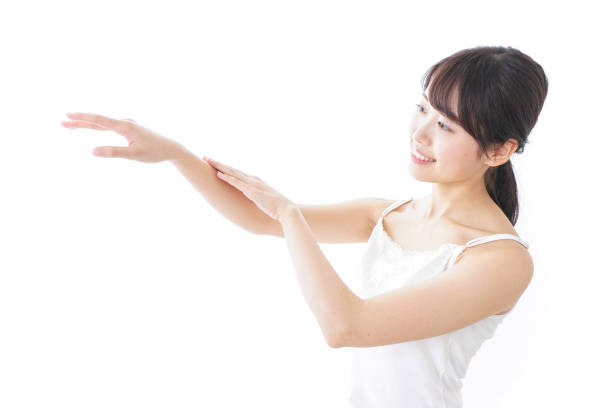 istock young woman applying a cream 873200594