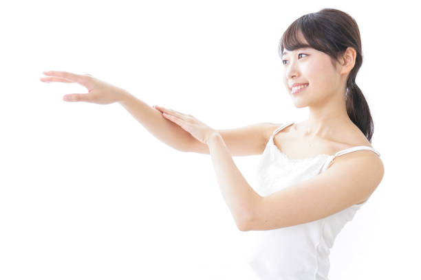 istock young woman applying a cream 873200644