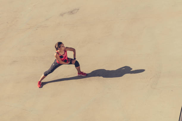 istock Sport women stretching her body 873208082