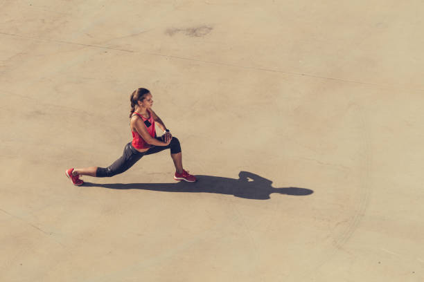 istock Sport women stretching her legs 873209188