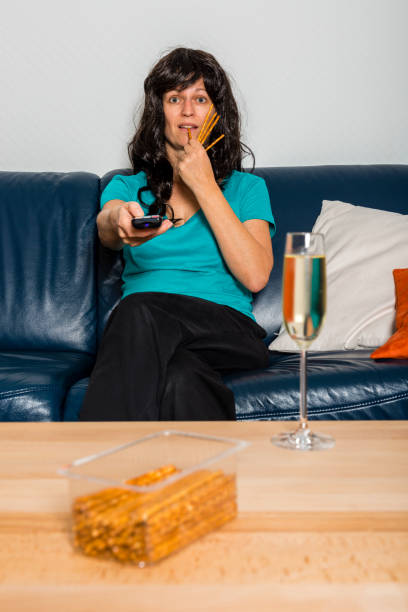 woman with television remote control