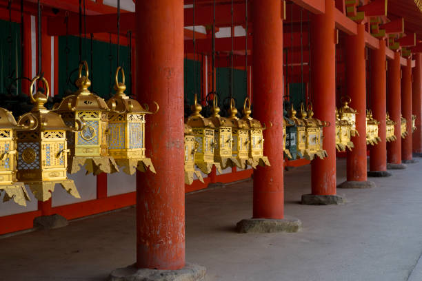 row of gold plated lanterns at the kasuga taisha shrine - gold plated imagens e fotografias de stock