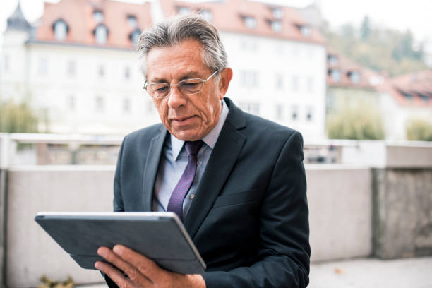 istock Close up of a businessman using digital tablet 873219698