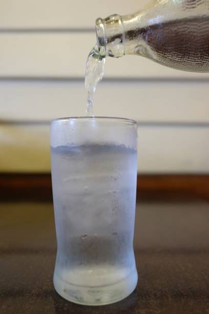 istock Water pouring into a glass with ice 873223918