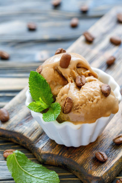 istock Homemade coffee ice cream in a white cup. 873227528