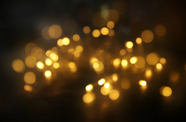 istock abstract bokeh background of golden light burst made from bokeh motion 873230510