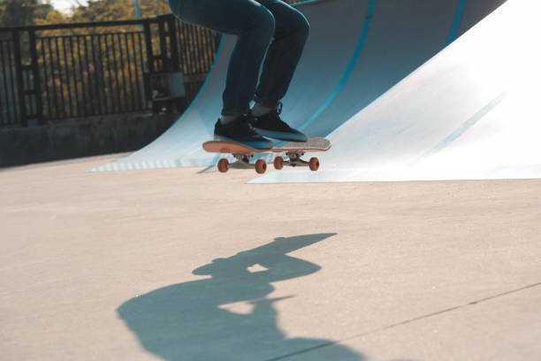 istock skateboarder legs skateboarding on skatepark 873231516
