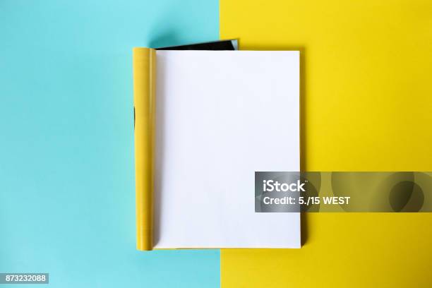 Mockup Magazine And Catalog Concept Top View Open Page Of The Magazine On A Blue And Yellow Background Copy Space Template Stock Photo - Download Image Now