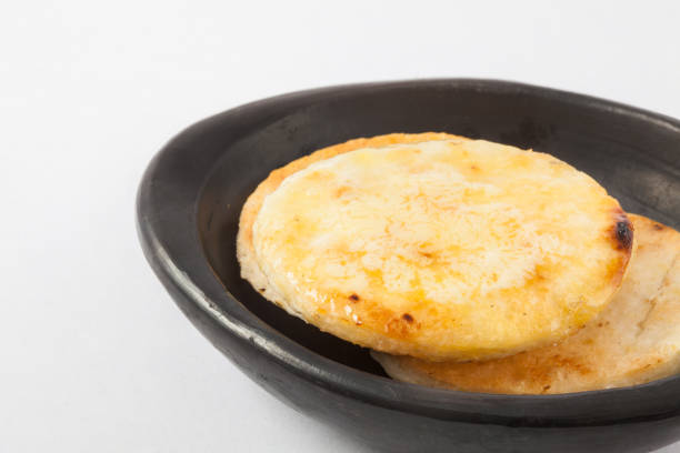 Colombian arepa topped with melted butter Traditional Colombian arepa topped with melted butter butter margarine isolated portion stock pictures, royalty-free photos & images