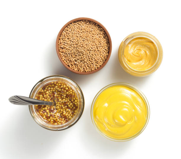 istock mustard sauce in bowl isolated on white 873235740
