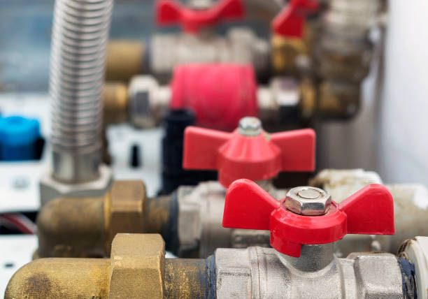 istock Pipes and valves in the heating boiler. Close up, selective focus. 873242546