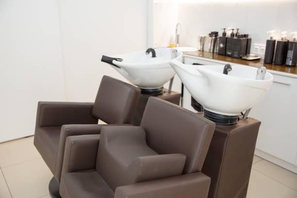 istock two leather armchairs with white wash basins in  beauty salon 873242668