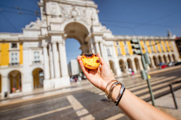 istock Holding pastel de Nata cake outdoors 873246102