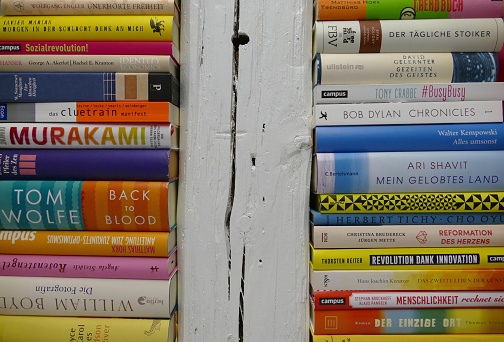 Stack of books and white beam between