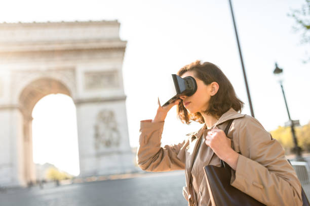 istock tourist woman using a virtual reality device in paris 873250062