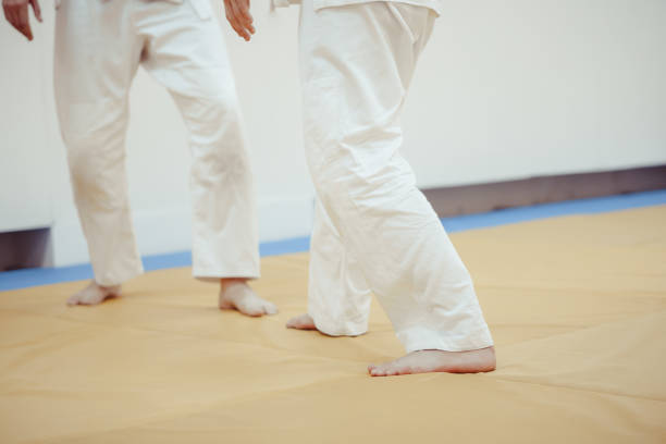 istock feet on the Mat in battle 873252834