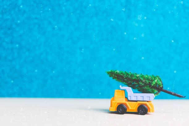 istock Christmas tree on miniature car. Christmas seasons celebration concept 873253028