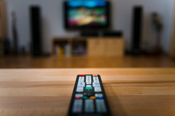ready for watching television ready for watching television. Picture on TV is from myself. remote control on table stock pictures, royalty-free photos & images