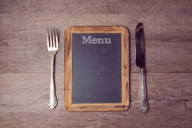 istock Creative menu background with chalkboard and silverwear. View from above 873256760