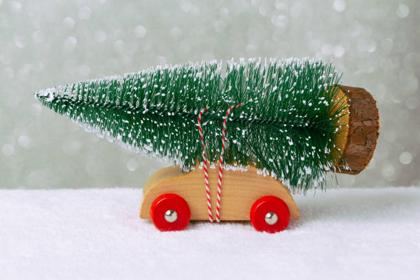 istock Christmas holiday concept with pine tree on toy car 873256856