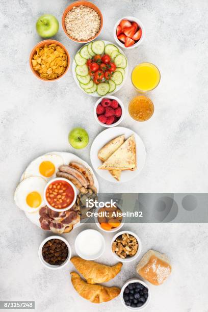 Full English Breakfast Eggs Bacon Sausages Breads And Fruits Stock Photo - Download Image Now