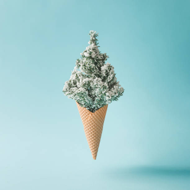 Soft ice cream in hand on background of broken ice