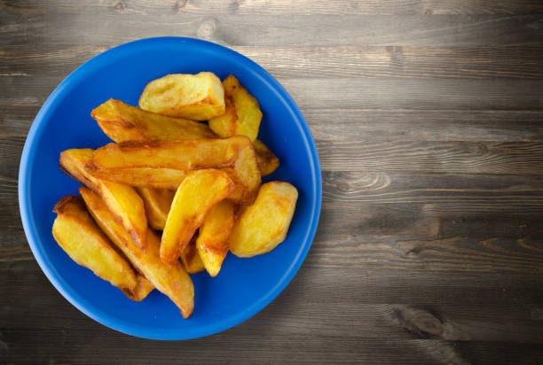 istock fry potatoes on a wooden background 873267642