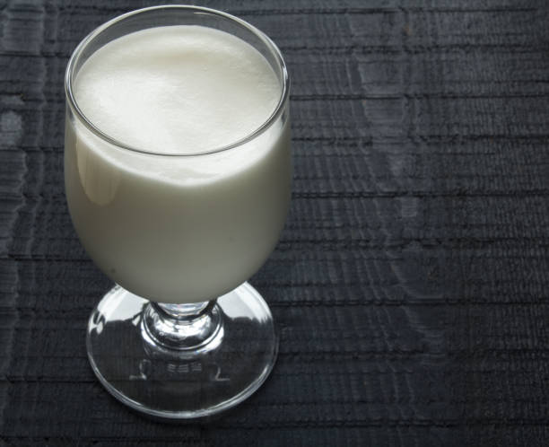 istock a wineglass with milk cocktail isolated on the black background 873271012