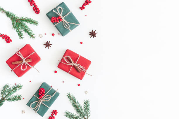 istock Christmas gifts, pine branches, toys. Flat lay, top view 873272468