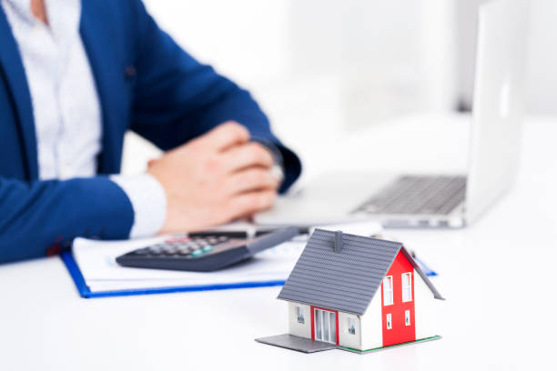 istock Real Estate Concept With Miniature House in Office 873272570