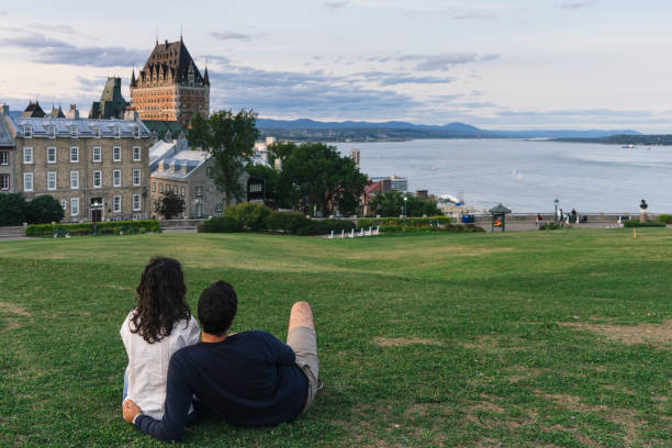 Couple admiring sunset in Quebec city Couple admiring sunset in Quebec city chateau frontenac hotel stock pictures, royalty-free photos & images