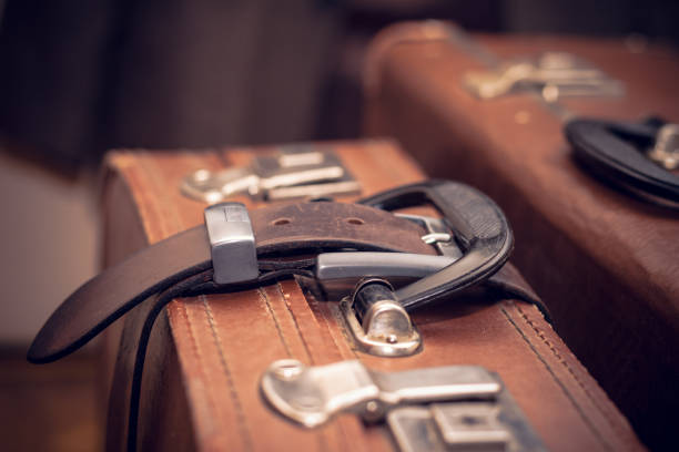 istock Vintage suitcase strapped belt 873275758