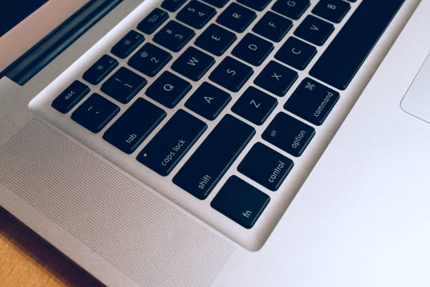 istock Modern Black Keyboard on a wooden desk 873282006