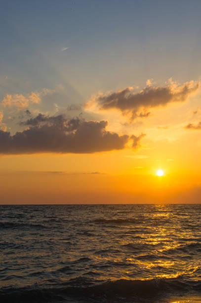 istock Amazing sea sunset, the sun, waves, clouds 873282114