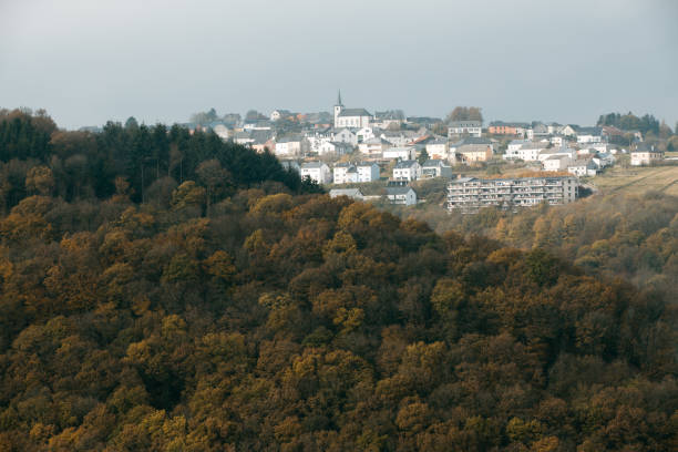 istock Bourscheid village on the hill with autumn colors 873282770