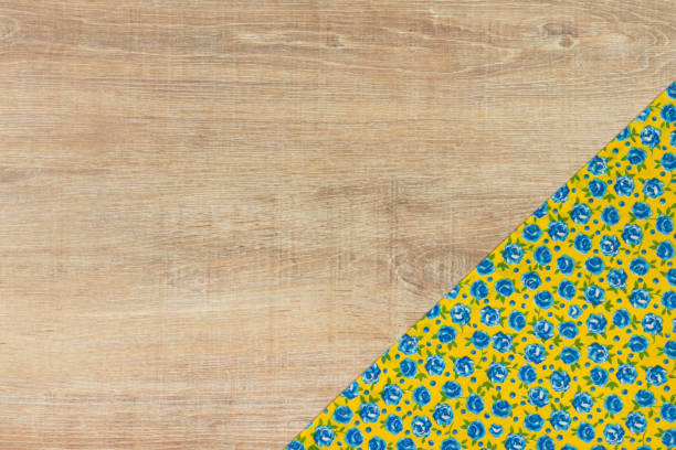 istock Pattern flower cloth napkin on empty wooden background. 873286556