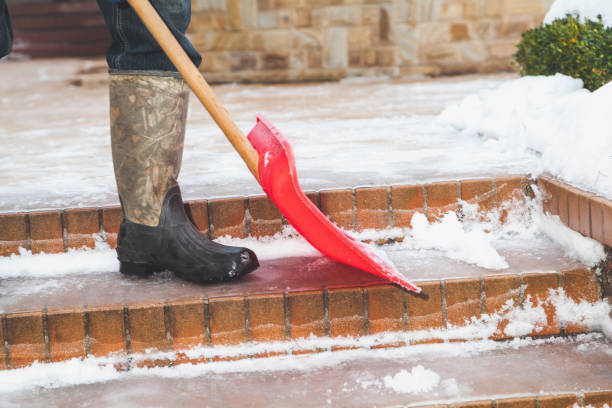istock Cleaning of stair steps from plastics snow shovel 873286644