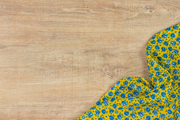 istock Pattern flower cloth napkin on empty wooden background. 873286718