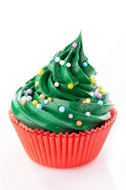 Green cupcake in red cup stock photo
